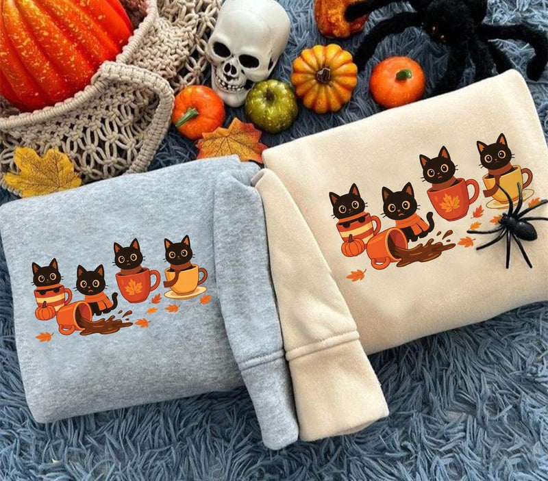 Herbst-Pullover mit schwarzen Katzen in Kaffeetassen
